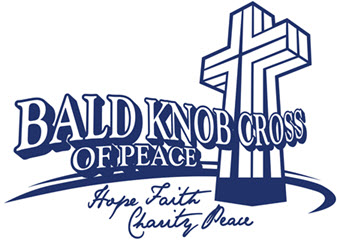 A blue and white logo for the bald knob cross of peace.